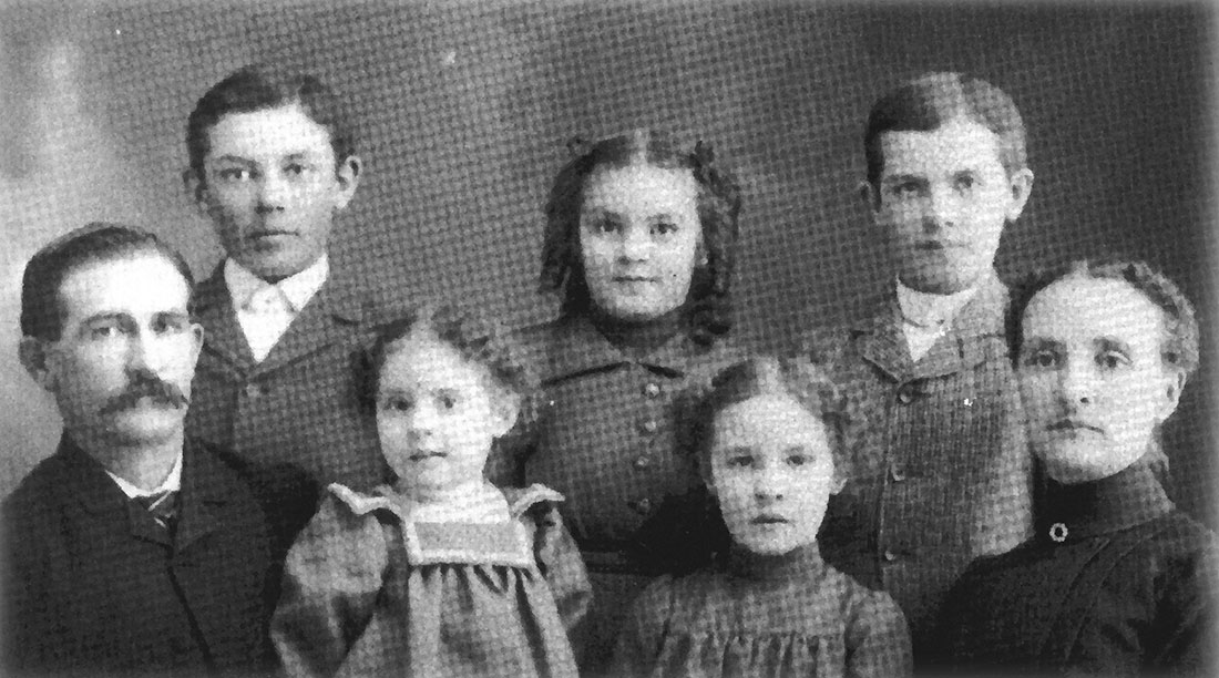 Left to right: Frank, Clarence, Audrey, Marie, Hazel, Olin and Carrie. The youngest two, Wayne and Day, were not yet born.