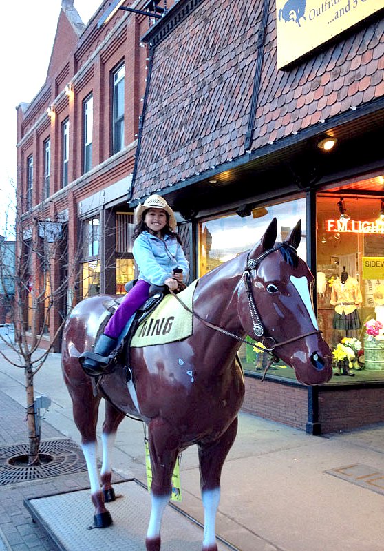 Jillian B on Lightning outside F.M. Light and Sons in Steamboat Springs, CO - Western Wear for Over 100 Years