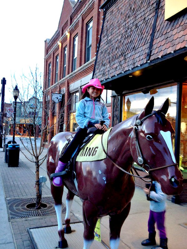 Sydney B on Lightning outside F.M. Light and Sons in Steamboat Springs, CO - Western Wear for Over 100 Years