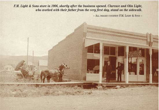 F.M. Light & Sons store in 1906, shortly after the business opened. Clarence and Olin Light, who worked with their father from the very first day, stand on the sidewalk. 