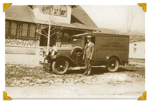 Clarence Light Standing Beside his Store on Wheels Used During the Depression| F.M. Light and Sons, Western Wear in Steamboat Springs, CO | Historical Photo, 1928