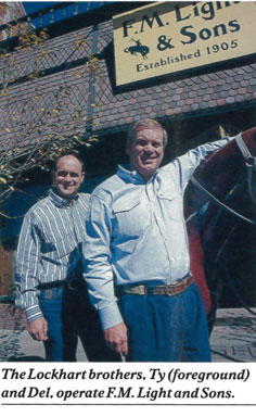 Photo of Ty and Del Lockhart outside F.M. Light and Sons in Steamboat Springs - Photo and article by Eric Grant for American Cowboy Magazine