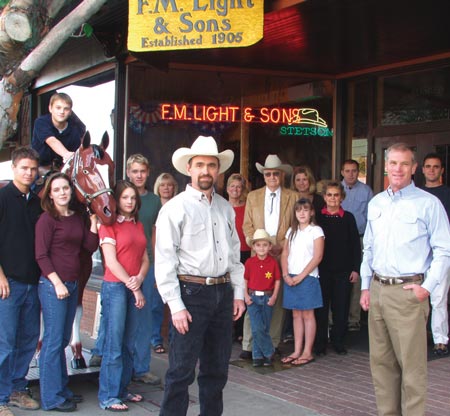 Photo of Lockhart Family - descendants of F.M. Light outside their western wear store in Steamboat Springs, CO - from an article in Western and English Today