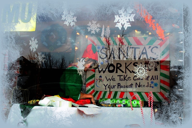 Christmas Elf Wrapping Gifts in F.M. Light and Sons Window